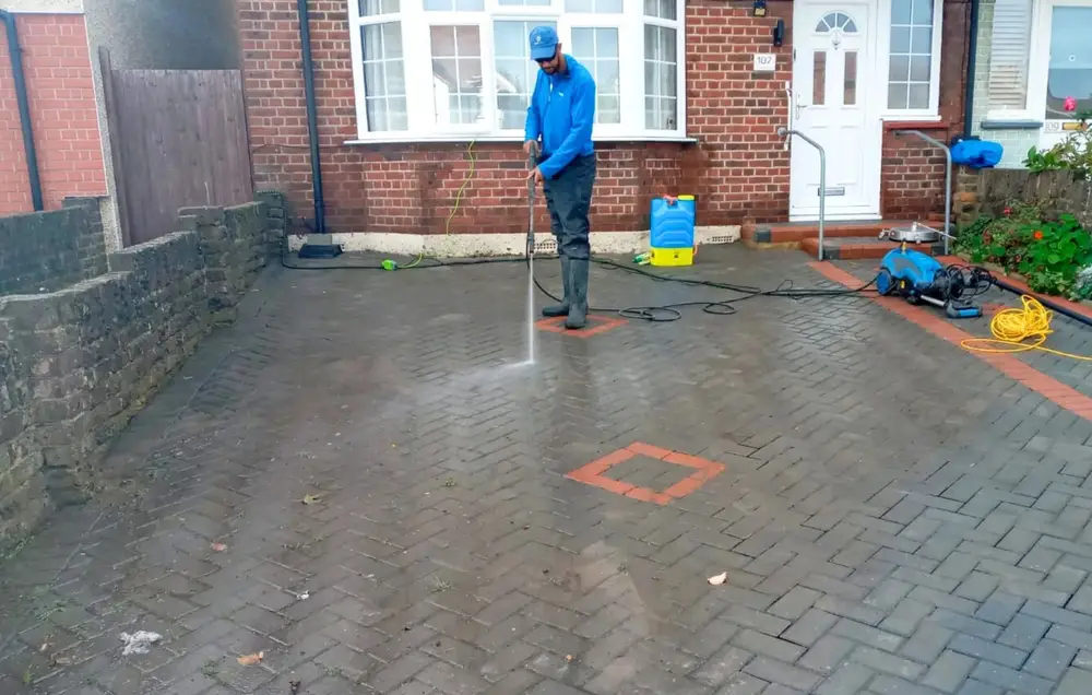 Jet washing a block paved driveway in Greenford